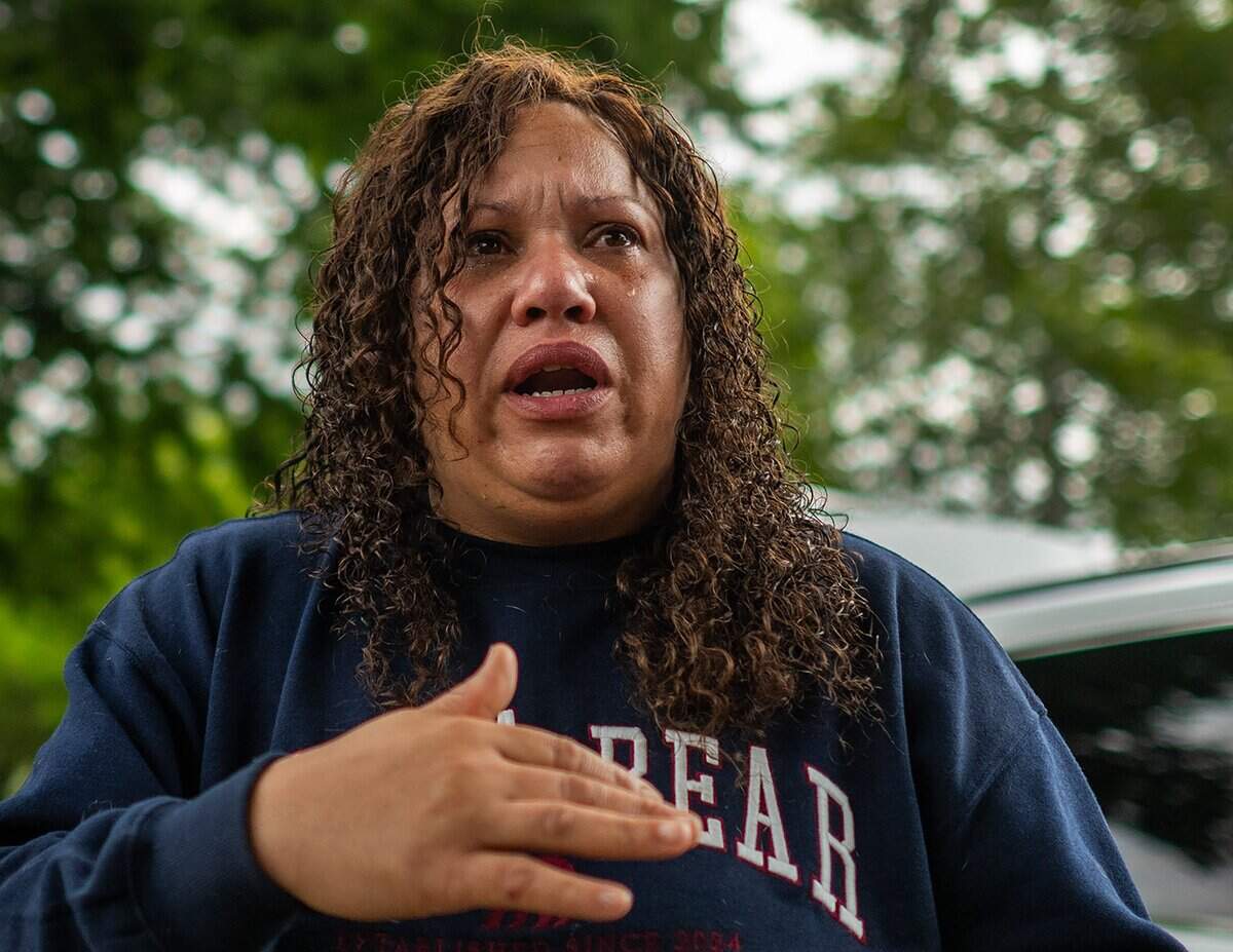 Tears stream down Jocelyn Wright’s face as she talks about her childhood trauma at Lawrence Park in Sacramento on May 5.