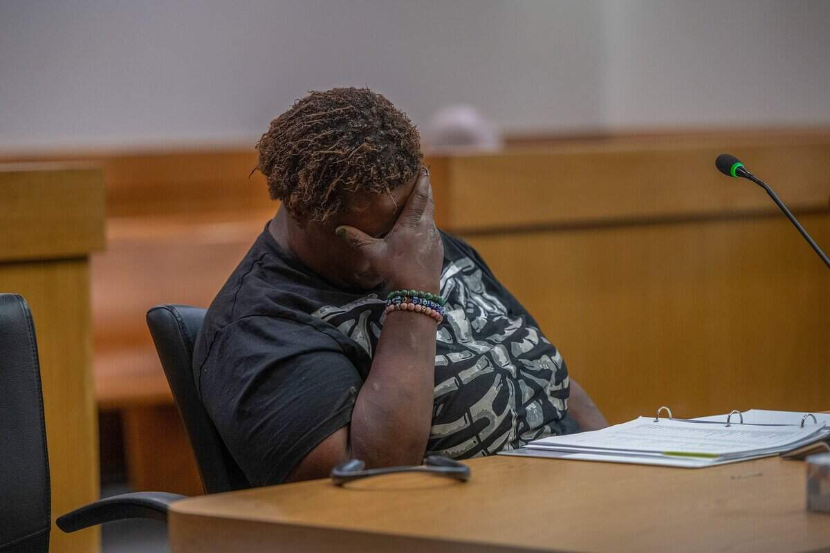 Elizabeth Williams, 38, who is homeless, puts her head in her hand during a recess in which Judge Stephen Lau left to review a briefing during a hearing for her small claims lawsuit against the City of Sacramento at the Carol Miller Justice Center on March 25, 2026.