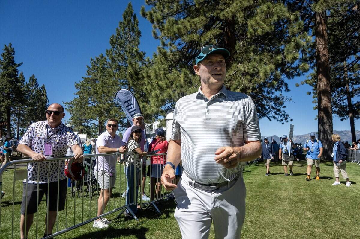 Former San Francisco 49er quarterback Steve Young hustles between the 17th hole and 18th tee during the American Century Championship at Edgewood Tahoe Golf Course in Stateline, Nev., on Friday, July 10, 2026.