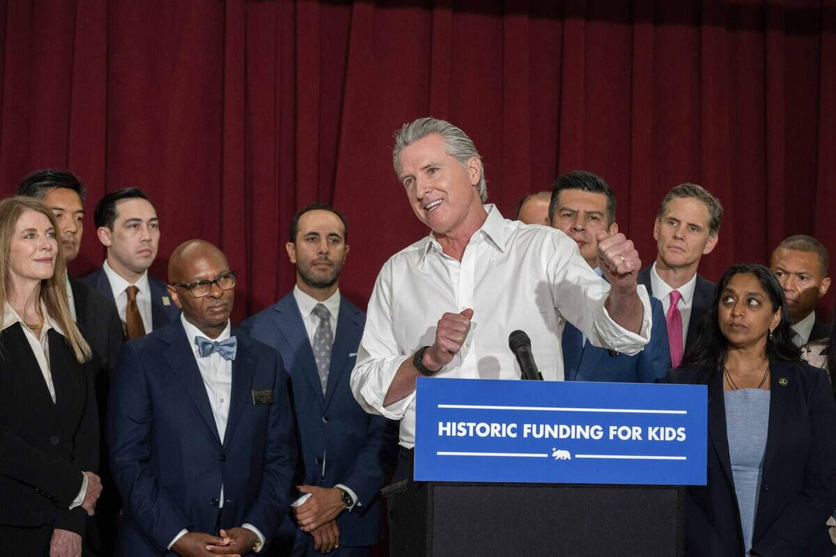 Gov. Gavin Newsom gestures during a new conference at Willett Elementary School in Davis on Thursday after signing Assembly Bill 126, which will increase funding for special education across the state.