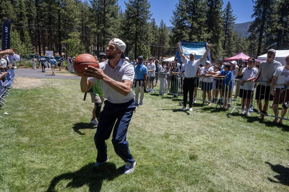 The Sacramento Kings’ Zach LaVine shoots a basketball before getting to the 18th tee as former NFL quarterback Derek Carr reacts during the American Century Championship at Edgewood Tahoe Golf Course in Stateline, Nev., on Friday.