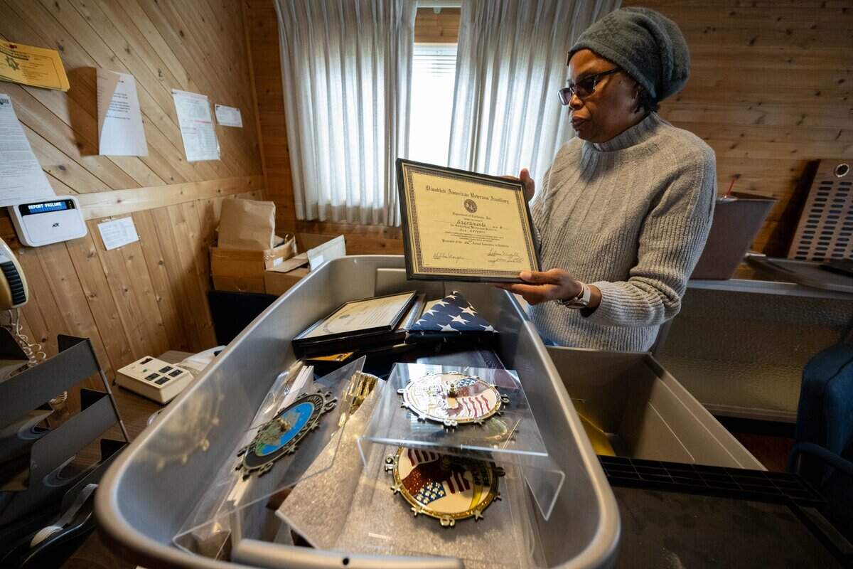 Karen Wilson-Randles, 59, a U.S. Army veteran, holds a commendation at Disabled American Veterans No. 6 building in Sacramento County in May.