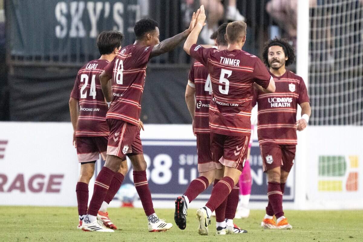 Republic FC teammates celebrate after a goal by forward Mayele Malango (7) during a match against Rhode Island FC in Sacramento on Wednesday. Republic FC defeated Rhode Island 2-1.
