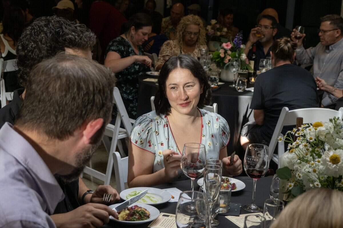 Madisen Pearce samples a peppercorn-crusted pork loin served over fresh polenta with sweet corn, roasted sweet peppers and grilled peaches during the Savor East Sac Chef's Challenge on Friday, July 24, 2026
