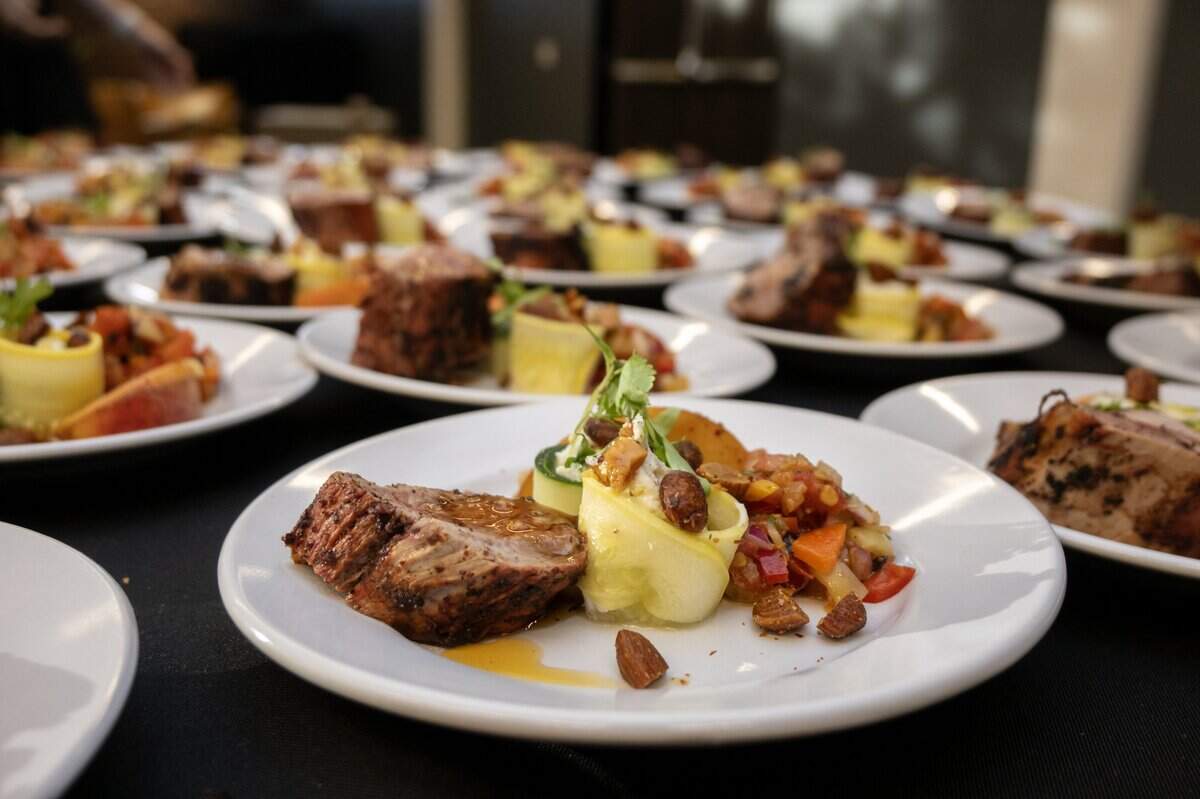 Sumac-crusted pork with whipped California burrata, charred sweet corn succotash, roasted stone fruit, heirloom tomatoes, zucchini, stone fruit gastrique, basil oil, pickled sweet peppers, and toasted almonds is served during the Savor East Sac challenge on Friday, July 24, 2026.
