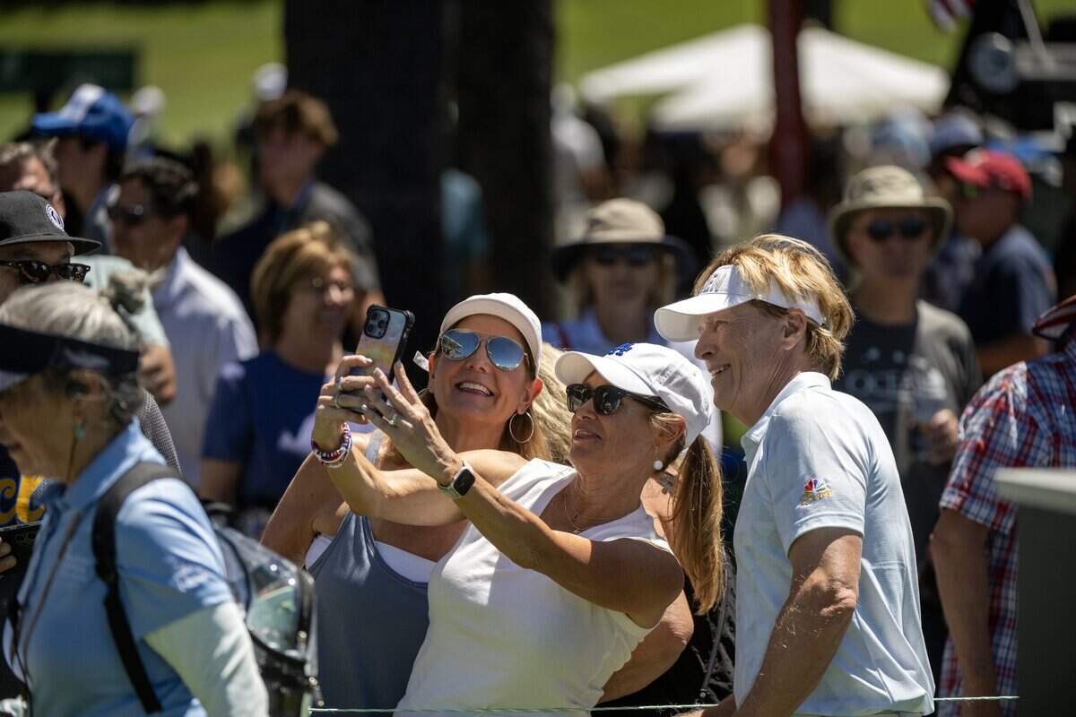 Actor Jack Wagner poses for a photograph with fans during the American Century Championship at Edgewood Tahoe Golf Course in Stateline, Nev., on Friday, July 10, 2026.