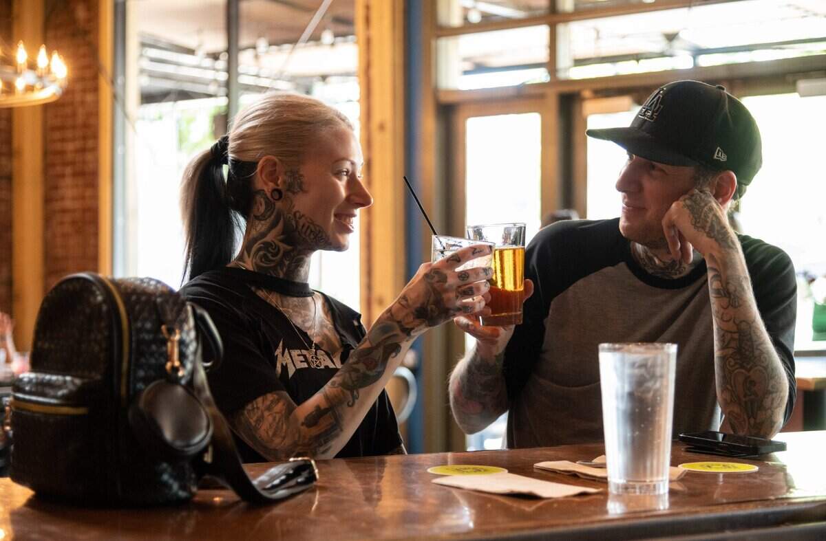 Lindsey and Shan Dan Horan toast during happy hour at Paesanos in Sacramento on Friday, June 10, 2022.