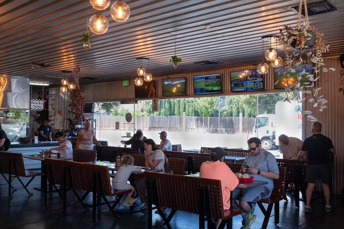 Patrons eat at Gami Burger in Carmichael on July 9, 2026.
