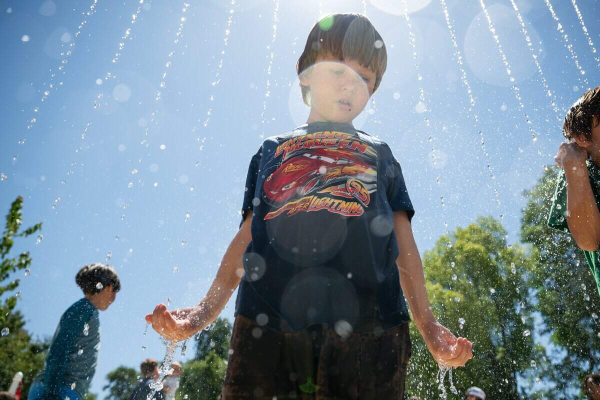 James Panko, 5, checks out the new splash pad at Westacre Park in West Sacramento on Thursday.