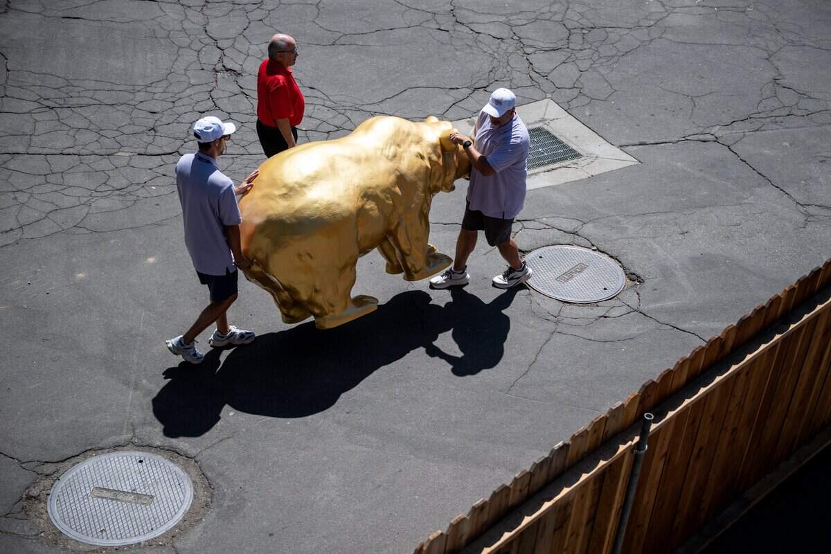 Event staff move a golden bear in preparation for the opening day of the California State Fair at Cal Expo in Sacramento on Wednesday, July 15, 2026. The fair opens to the public on July 17.