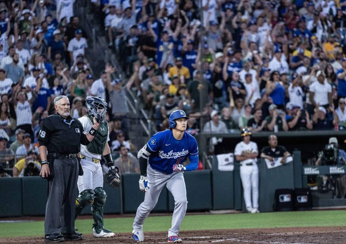 The Los Angeles Dodgers' player Shohei Ohtani (17) watches the ball go over the fence as he hits a three-run home run against the Athletics on Monday, June 29, 2026, at Sutter Health Park in West Sacramento.