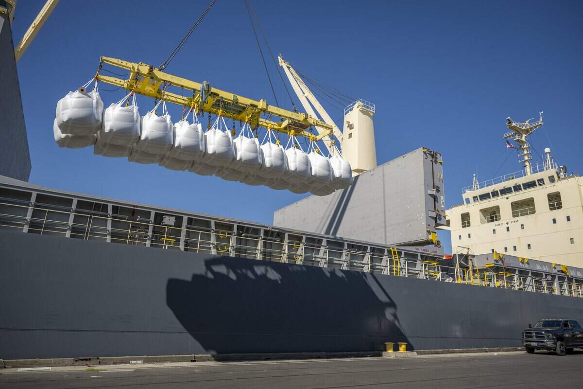 Bags of rice are lifted onto a ship in the Port of West Sacramento on Thursday, July 31, 2025.
