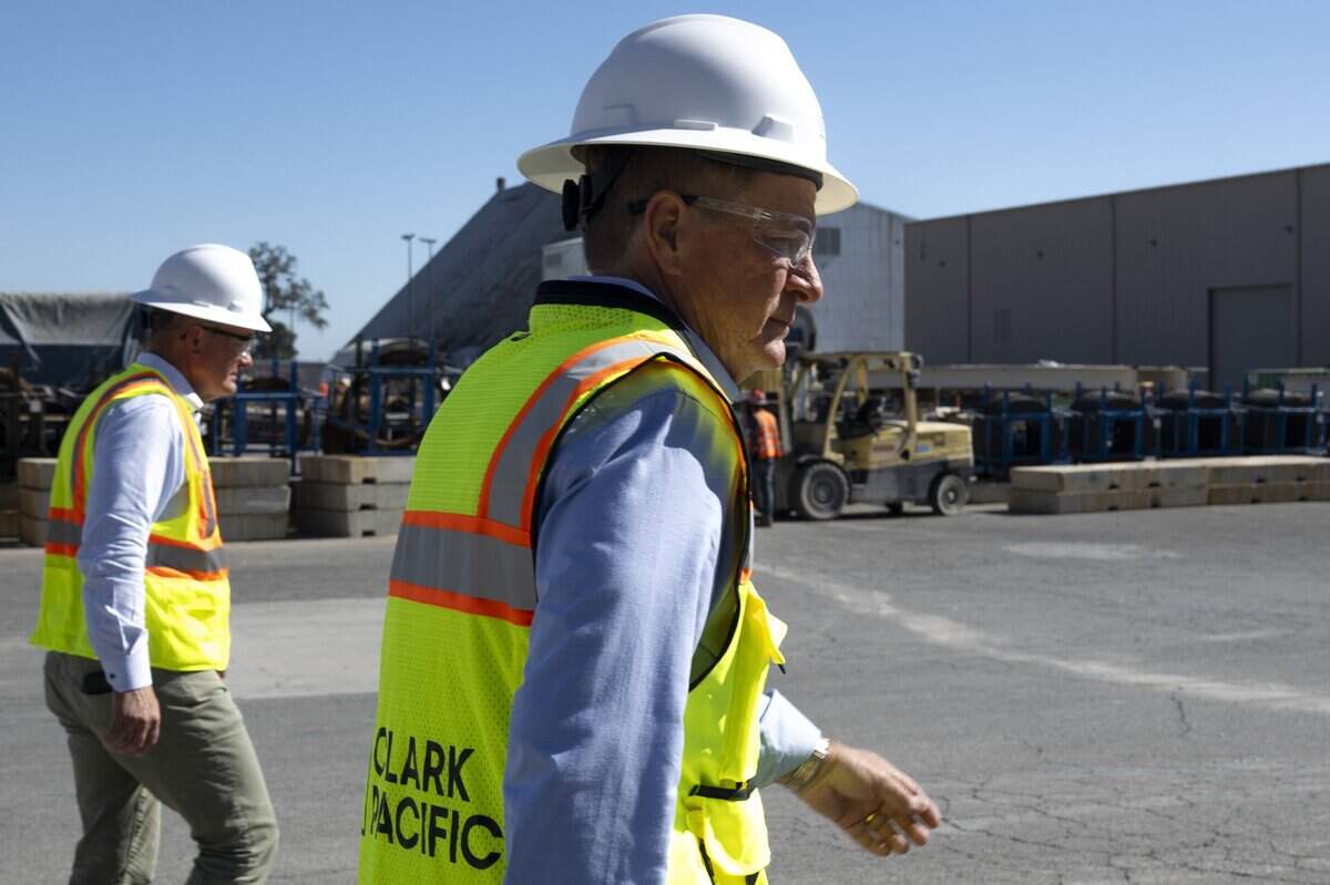 Clark Pacific co-CEOs Don Clark, left, and Bob Clark walk through the company’s Woodland facility earlier this month. The company has operated the plant for more than 20 years and is seeking access to Woodland’s water and sewer system while pursuing an approved expansion.