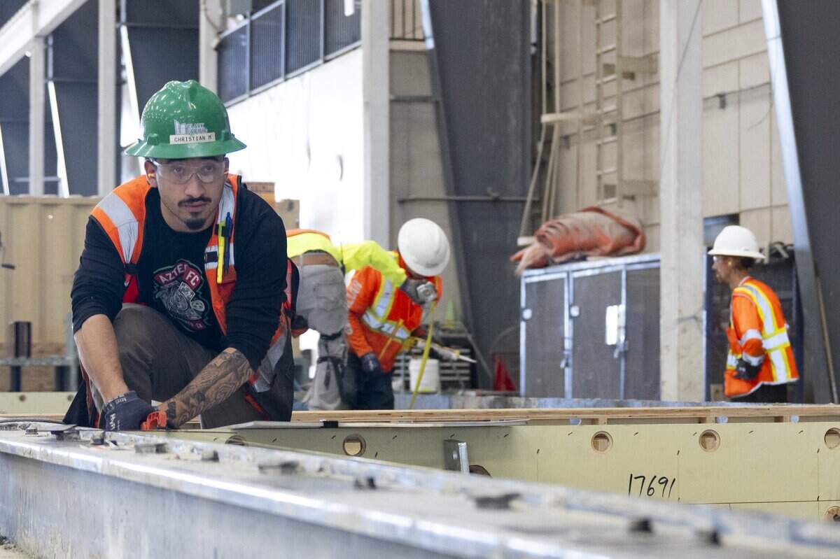 Clark Pacific employees work on prefabricated concrete components at the company’s Woodland facility earlier this month. The company has operated the plant for more than 20 years and is seeking access to Woodland’s water and sewer system while pursuing an approved expansion.
