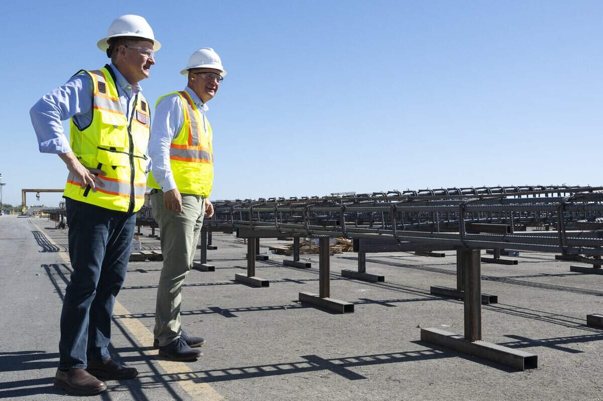 Clark Pacific co-CEOs Bob Clark, left, and Don Clark stand beside rebar frameworks at the company’s Woodland facility earlier this month. The company has operated the plant for more than 20 years and is seeking access to Woodland’s water and sewer system while pursuing an approved expansion.