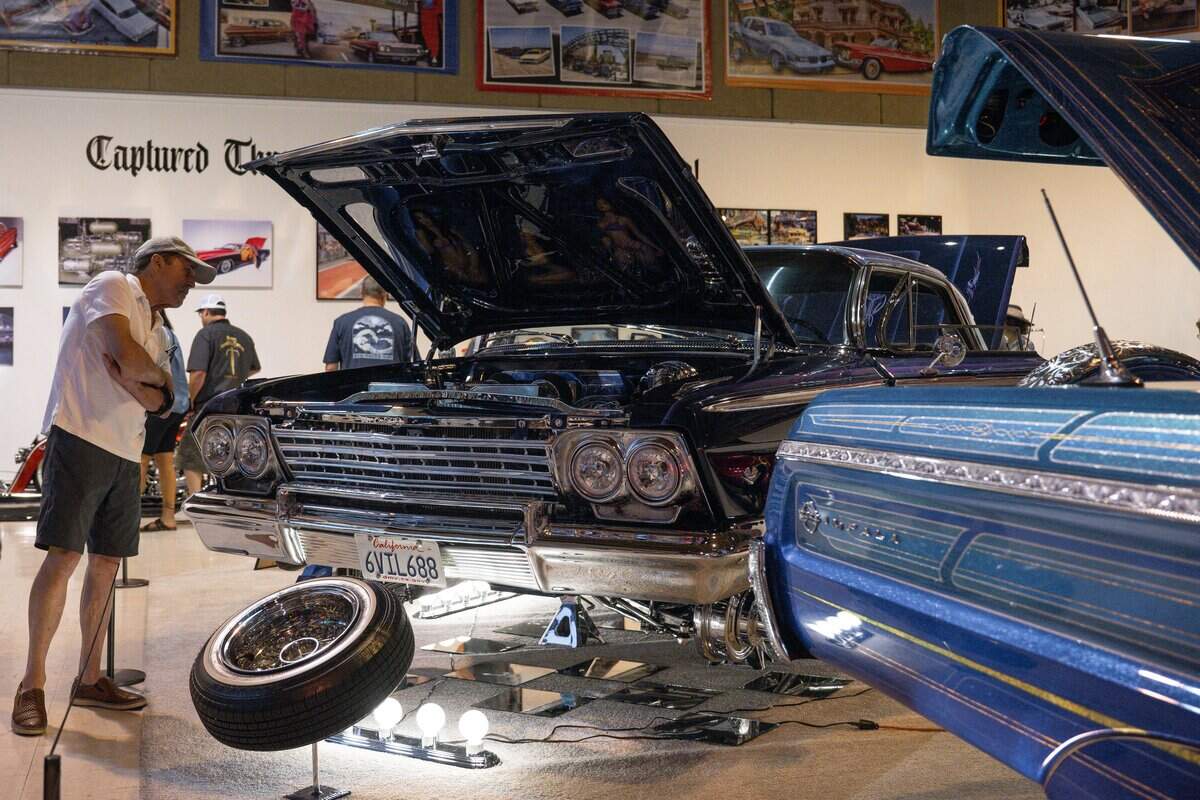 Visitors check out cars on display at the CaLOWfornia Love: The Lowrider Culture Exhibit at the California State Fair at Cal Expo in Sacramento on Friday, July 24, 2026.
