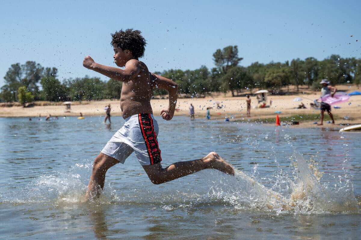 Ilijah Jones, 10, cools off at Folsom Lake State Recreation Area in Granite Bay on Tuesday, July 14, 2026.