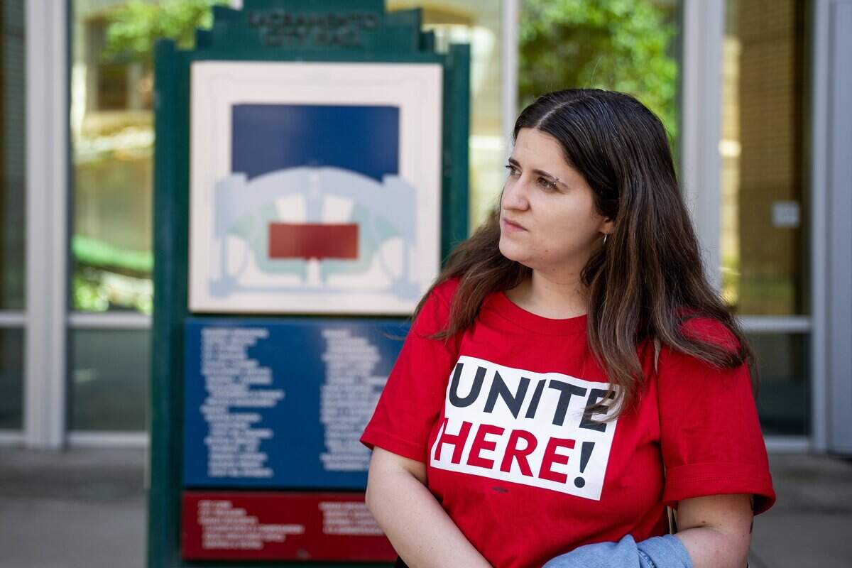 Unite Here Local 49 spokesperson Sonya Karabel listens as a city of Sacramento staff member and Railyards residents talk about the proposed expansion of a special Railyards tax financing district after a meeting of the Railyards Public Financing Authority at City Hall on Tuesday.