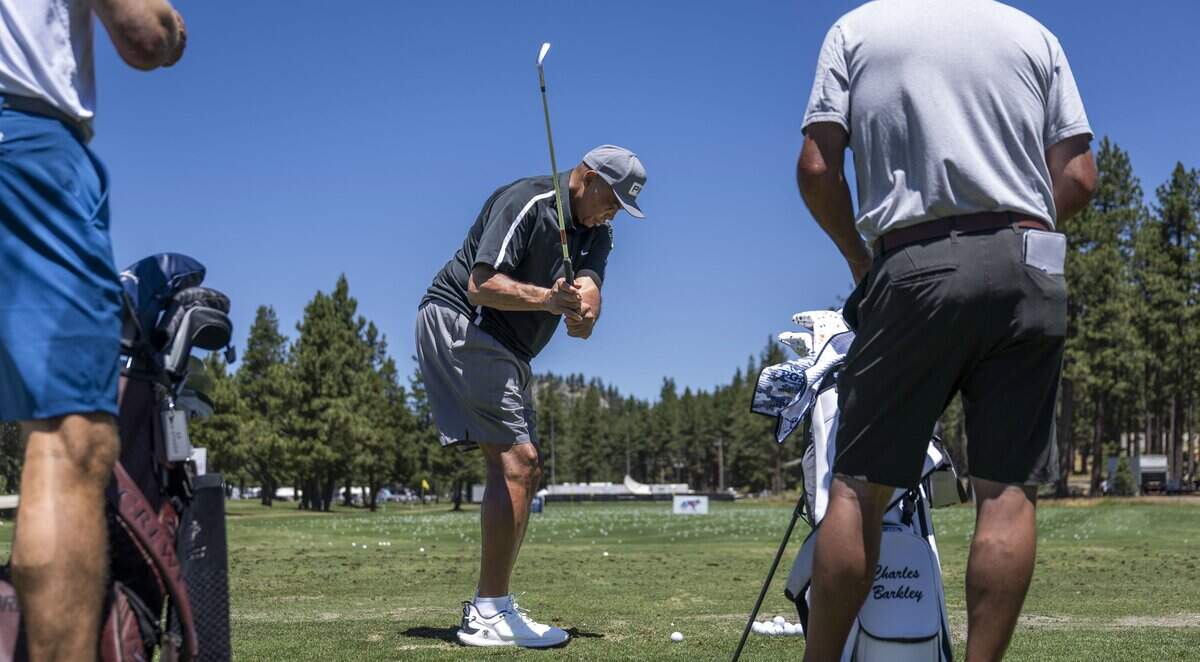 NBA Hall of Famer Charles Barkley warms up on the driving range during the American Century Championship at Edgewood Tahoe Golf Course in Stateline, Nev., on Thursday.