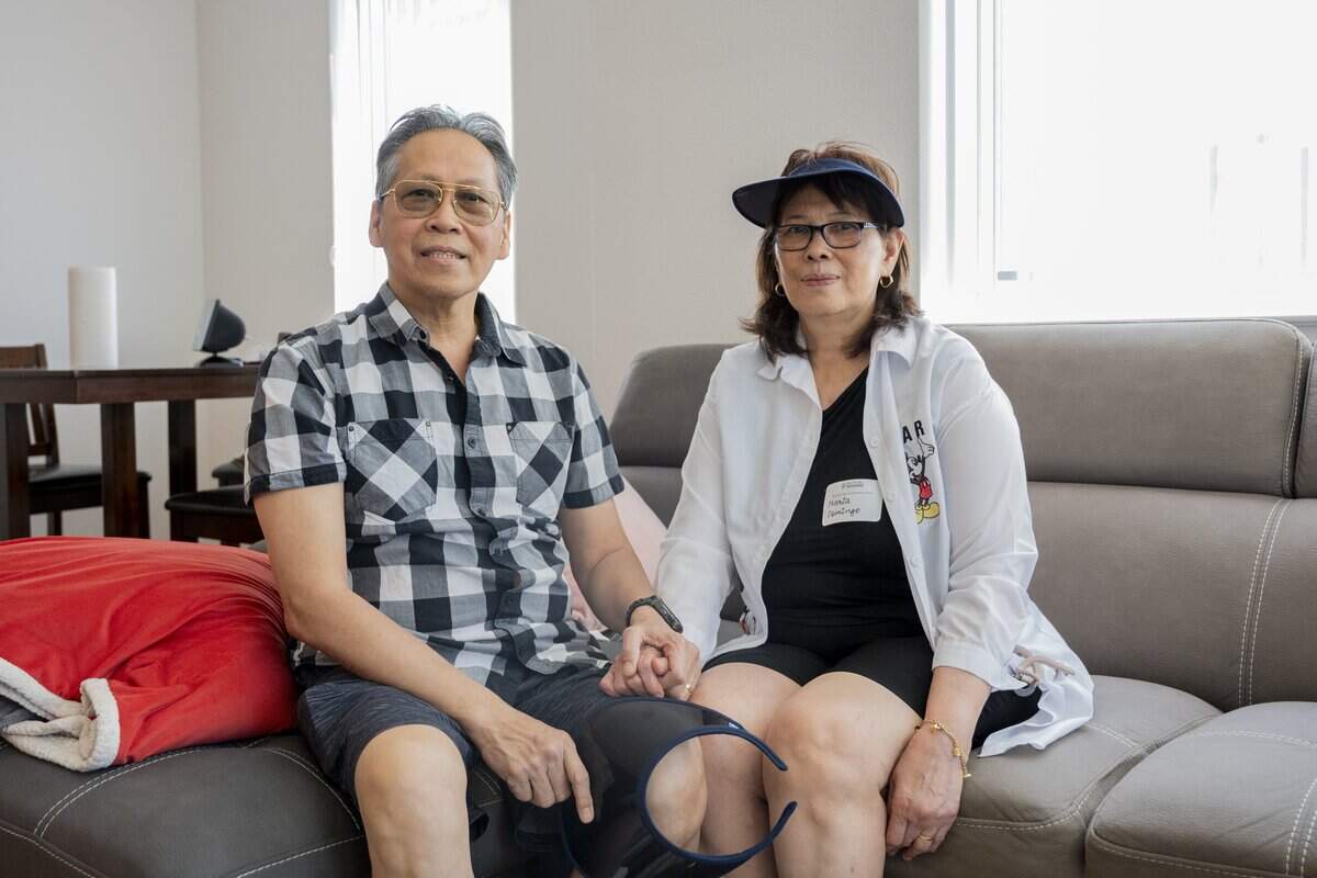 Orence and Maria Domingo sit in their living room at the newly opened San Juan Apartments in south Sacramento on Tuesday. The Domingos moved into the apartment a month before the grand opening after winning the housing lottery.