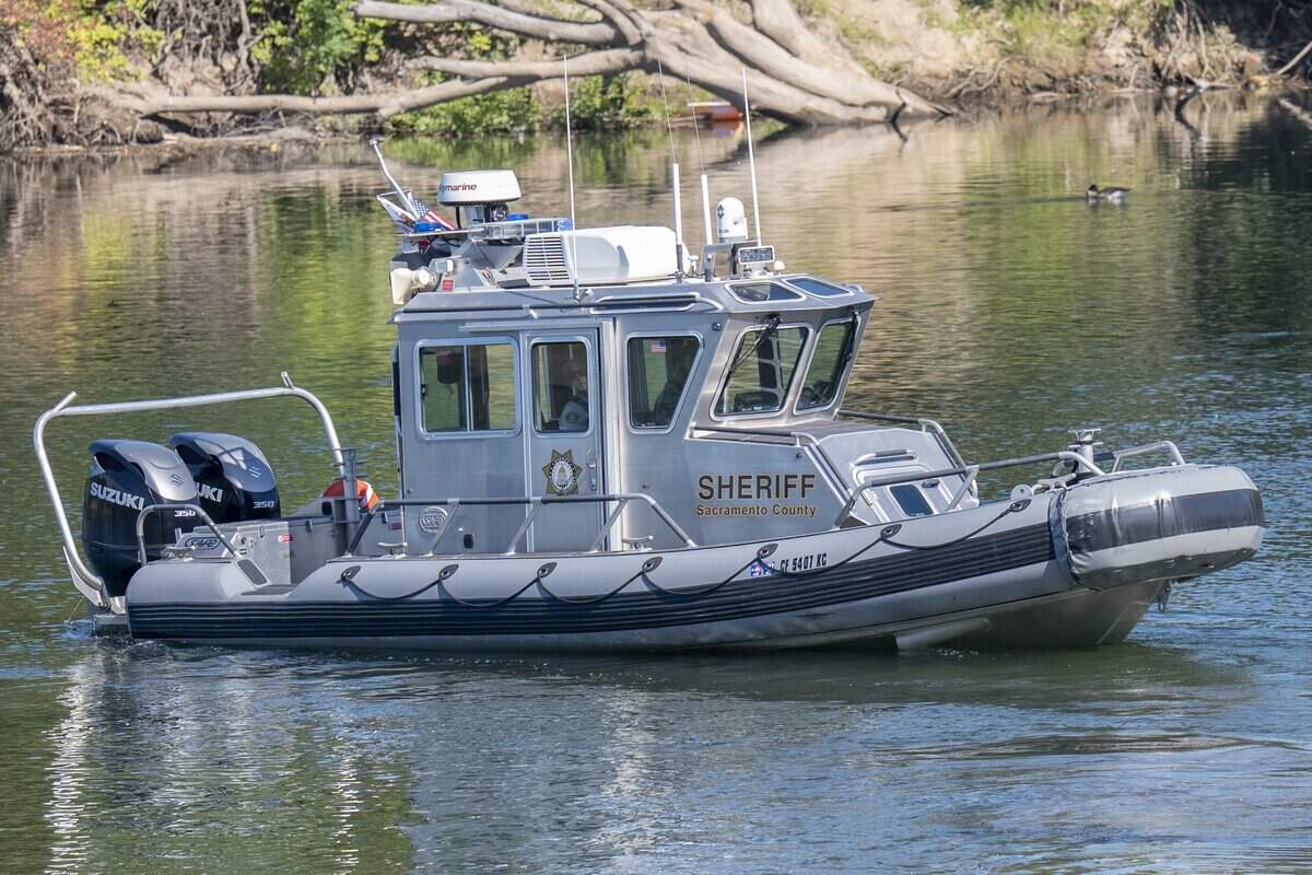 A Sacramento County Sheriff’s Marine Enforcement patrol boat sits by the shore during a summer water safety press conference held at Tiscornia Park in Sacramento on Wednesday.