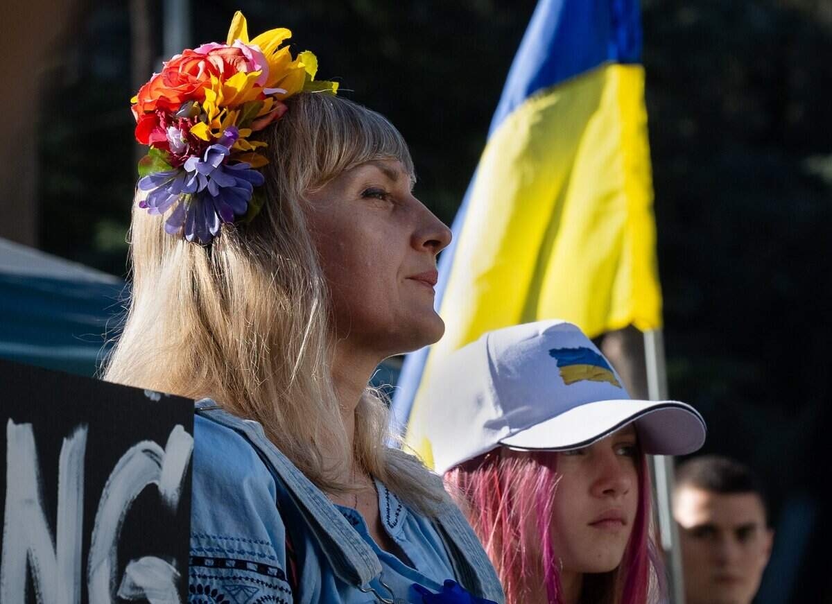 Galyna Shpilman joins in singing the Ukrainian national anthem in front of the west steps of the state Capitol on Monday during an event marking the abduction of the county’s children in the Russian-Ukrainian War. The Shpilmans moved to the United States from Melitopol, Ukraine, and have lived in Sacramento for the past 3 1/2 years.