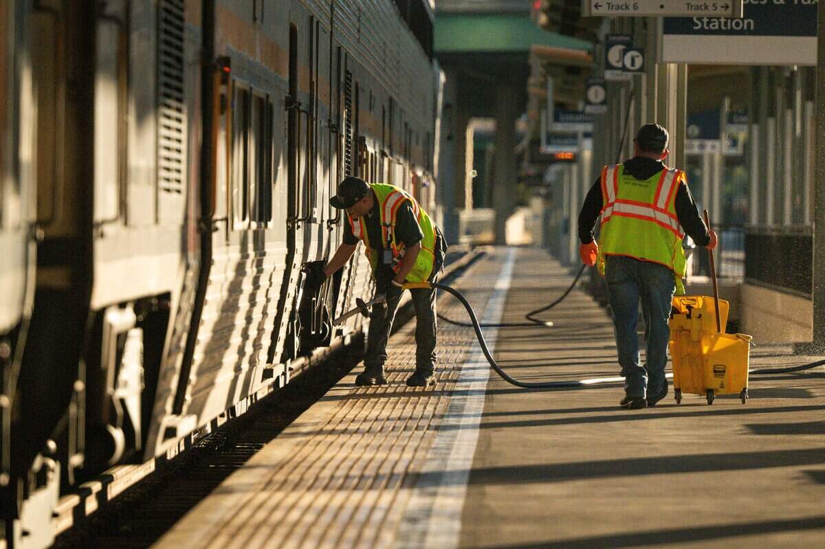 Workers maintain Amtrak trains at Sacramento Valley Station in Sacramento on Wednesday, July 22, 2026.