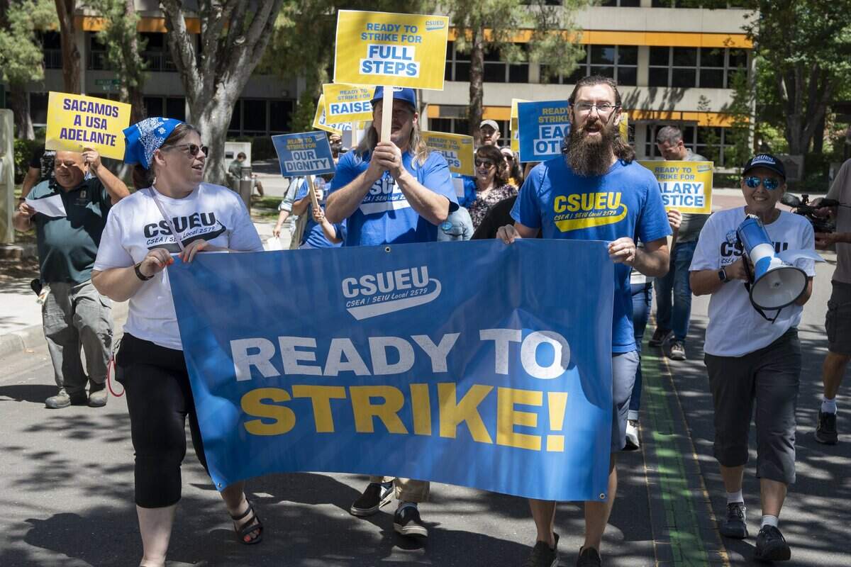 Members of the California State University Employees Union march at Sacramento State on Tuesday, June 30, 2026 — the day their contracts expire. The march was part of a series of systemwide union actions launched as negotiations for a fresh contract are ongoing. Union members are asking for better pay and reduced dependence on temporary workers.