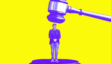 David Ellison underneath a gavel that's about to hit him in the head