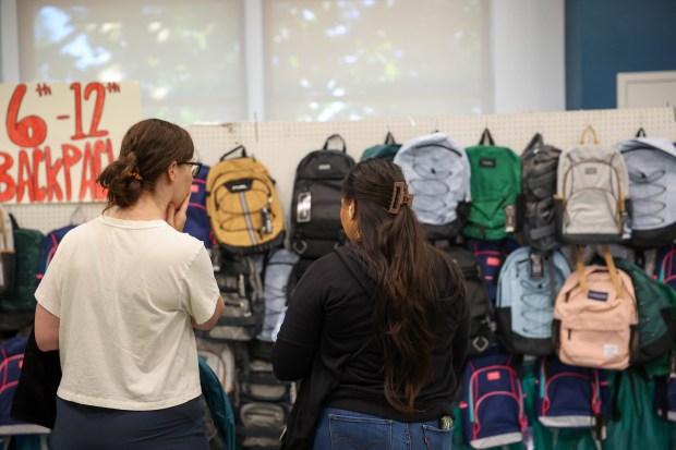 People look at backpacks at Sacred Heart Community Service in San Jose, Calif., on Tuesday, July 28, 2026. (Shae Hammond/Bay Area News Group)