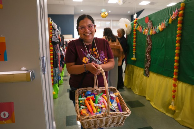 Marita Zavaleta, of San Jose, pass out toys for children at Sacred Heart Community Service in San Jose, Calif., on Tuesday, July 28, 2026. (Shae Hammond/Bay Area News Group)