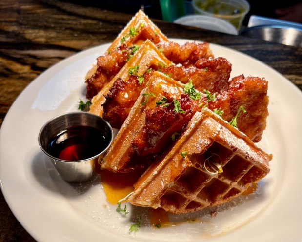 The chicken and waffles at Bloom Eatery, now in San Jose, includes scratch-made buttermilk fried chicken served on top of a Belgian waffle, drizzled with spicy honey ($23). (Courtesy Reza Manion)