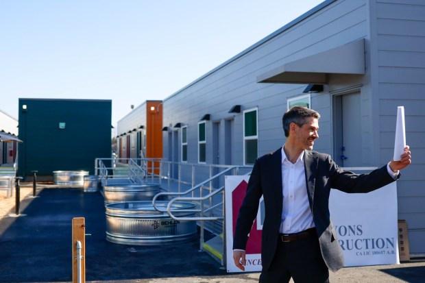 San Jose Mayor Matt Mahan walks towards a press conference at last emergency interim housing site at the VTA's Cerone Yard in San Jose, Calif., on Thursday, Feb. 5, 2026. (Shae Hammond/Bay Area News Group)