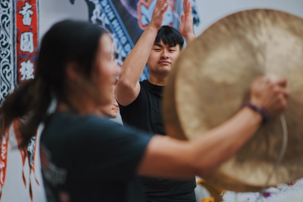 Sun Hing member Kevin Senh claps along with the rhythm, Friday, April 17, 2026, in San Jose, Calif. (Photo by Yu Wang)