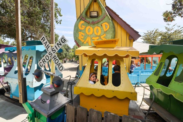 Families ride the brightly colored Jolly Trolley at Children's Fairyland in Oakland on Thursday, June 27, 2026. (Ray Chavez/Bay Area News Group)
