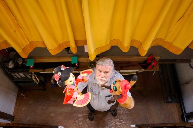 Children's Fairyland puppet theater director Randal Metz prepares for a puppet show backstage in Oakland, Calif., Thursday, June 27, 2026. Metz, who said he started at age 10, has been a puppeteer for 57 years. (Ray Chavez/Bay Area News Group)