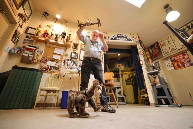 Children's Fairyland puppet theater director Randal Metz operates a bear puppet backstage in Oakland on Thursday, June 27, 2026. (Ray Chavez/Bay Area News Group)