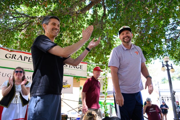 San Jose mayor Matt Mahan congratulates San Jose Giants president Ben Taylor after winning the celebrity grape stomp competition during the 44th annual Italian Family Festa held at History Park in San Jose, Calif., on Saturday, July 25, 2026. The event is hosted by the Italian American Heritage Foundation. (Jose Carlos Fajardo/Bay Area News Group)