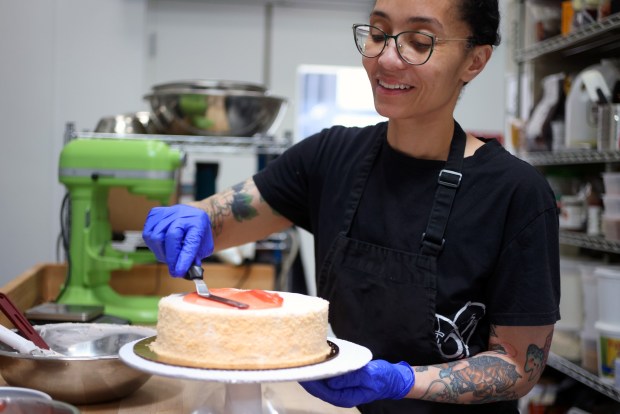 Tamara Esparza creates a guava cake in the kitchen of Honey and Pearl on Sunday, June 28, 2026, in Emerville. (Aric Crabb/Bay Area News Group)