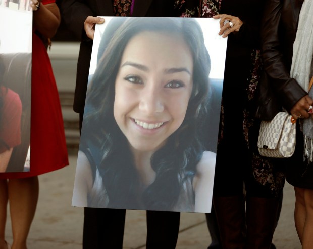 Marlene LaMar, right, and her husband Kevin Camara hold a picture of Sierra outside of the Santa Clara County Hall of Justice following the sentencing of Antolin Garcia-Torres in San Jose, Calif., on Tuesday, Dec. 12, 2017. (Nhat V. Meyer/Bay Area News Group)
