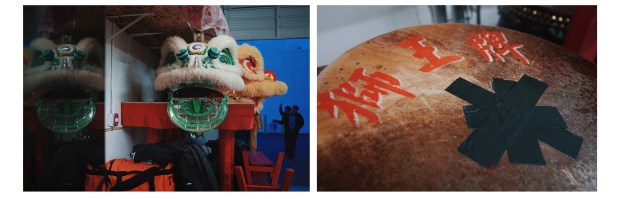 Left, two lion heads sit on the table in the warehouse of Sun Hing Dragon and Lion Dance Association. Right, the drum is an essential part of lion dance music. Painted in red on the drum Sun Hing uses for accompaniment are the Chinese characters, "Shi Wang Pai", which means "Brand of the Lion King." (Photo by Yu Wang)