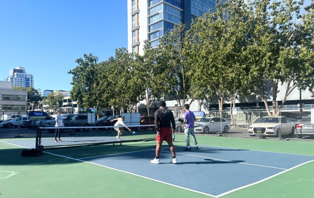 Pickleball players test out the courts at Club Volo, a new outdoor sports hub that opened at the Serpentine Plaza in downtown San Jose on Friday, June 26, 2026. (Sal Pizarro/Bay Area News Group)