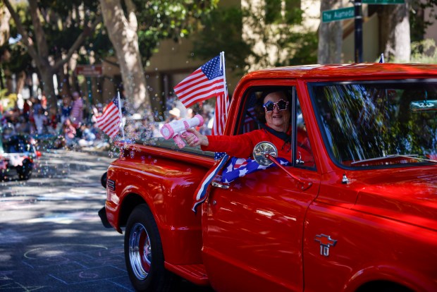 A woman blows bubbles from her truck during the RW&B Parade along The Alameda in San Jose, Calif., on Saturday, July 4, 2026. (Shae Hammond/Bay Area News Group)
