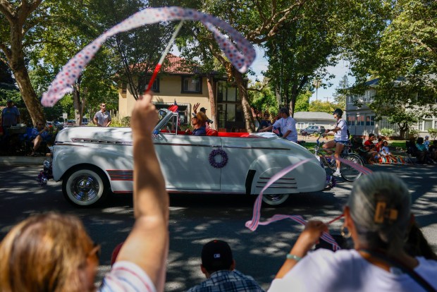 People wave streamers during the RW&B Parade along The Alameda in San Jose, Calif., on Saturday, July 4, 2026. (Shae Hammond/Bay Area News Group)