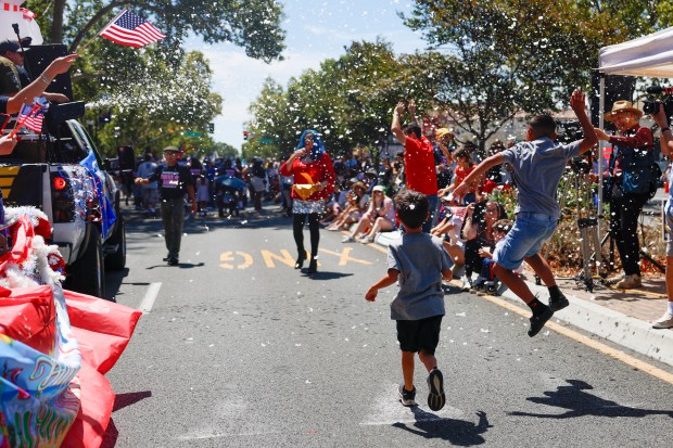 Children play with bubbles during the RW&B Parade along The Alameda in San Jose, Calif., on Saturday, July 4, 2026. (Shae Hammond/Bay Area News Group)