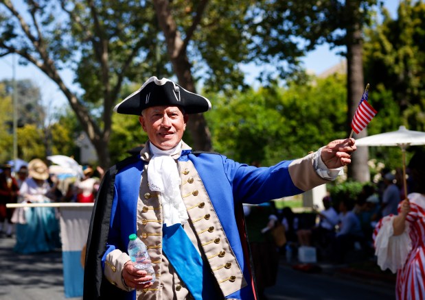 Thomas Santoro, of San Jose, walks dressed as George Washington with the Living Historicals during the RW&B Parade along The Alameda in San Jose, Calif., on Saturday, July 4, 2026. (Shae Hammond/Bay Area News Group)