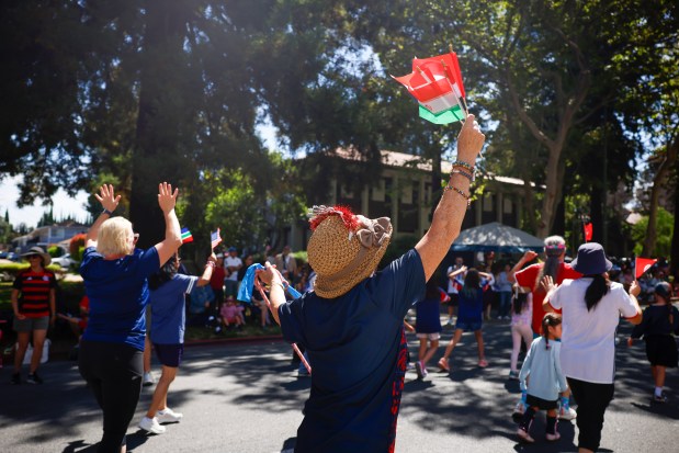 People walk in the parade during the RW&B Parade along The Alameda in San Jose, Calif., on Saturday, July 4, 2026. (Shae Hammond/Bay Area News Group)