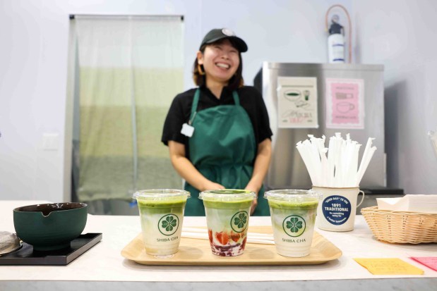 Shiba Cha barista Kaori Kori reacts after serving an order of matcha lattes for customers during the grand opening of Sakura Market in downtown San Jose on Friday, July 24, 2026. (Ray Chavez/Bay Area News Group)