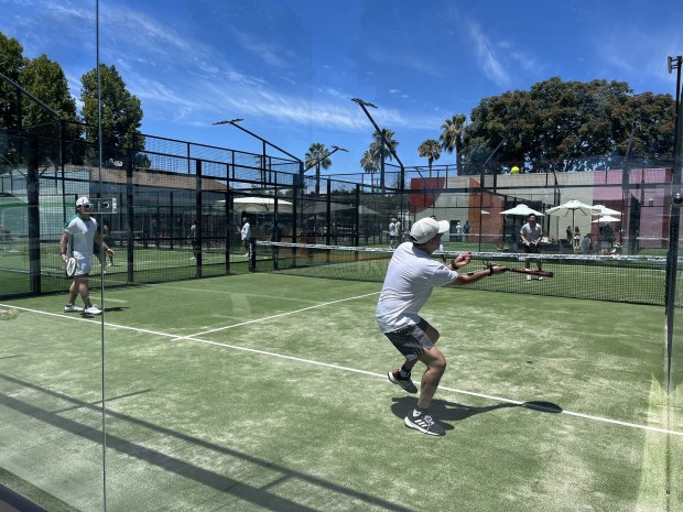 Players compete in a game at Bay Padel sports complex within the Creekside Socials community and sports district in downtown San Jose near the SAP Center and Diridon train station, seen on July 11, 2026.(George Avalos/Bay Area News Group)