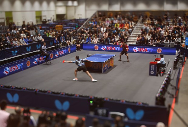Nikhil Kumar, bottom, reaches for the ball against Kanak Jha during the men's singles final for the 2026 U.S. National Table Tennis Championships at the San Jose McEnery Center in San Jose, Calif., on Wednesday, July 8, 2026. Photographed with a tilt-shift lens. (Nhat V. Meyer/Bay Area News Group)